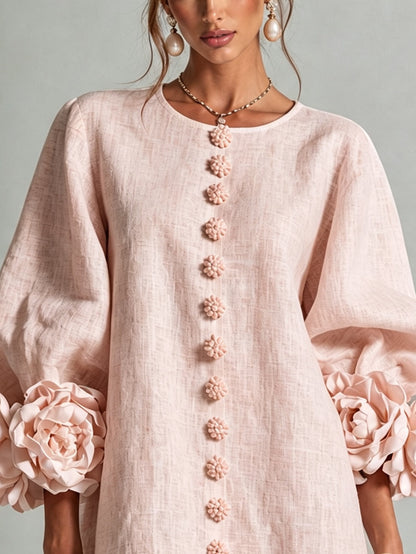 Vestido mini rosa con estampado floral y botones, con unas mangas florales sorprendentes